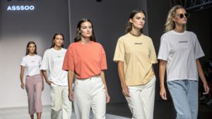 Colorful T-shirts in various styles and fits displayed on a rack